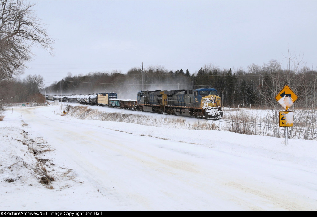Kicking up a small amount of snow, a matching pair of YN2 AC4400's take Q327 west